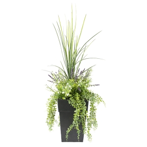 ARRANGEMENT WITH LAVENDER AND MIXED FOLIAGE IN A BLACK POT.
